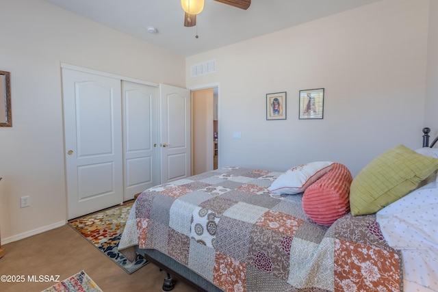 bedroom with carpet flooring, a ceiling fan, a closet, visible vents, and baseboards