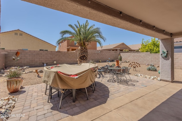 view of patio / terrace with a fenced backyard and outdoor dining area