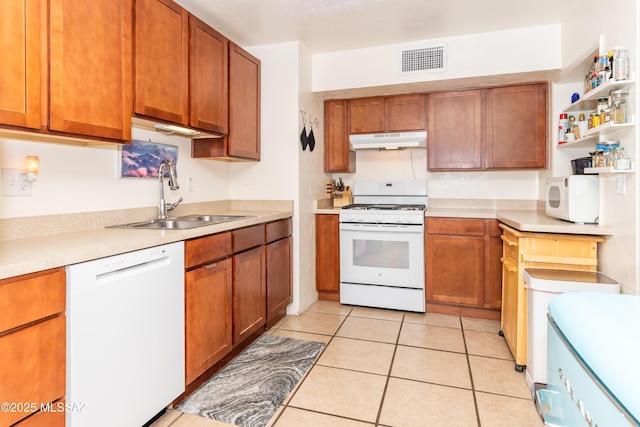 3541 E Cody St, Tucson, AZ 85716 - kitchen featuring white appliances, a sink, under cabinet range hood, and light countertops