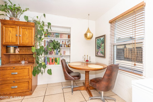 dining area with light tile patterned floors