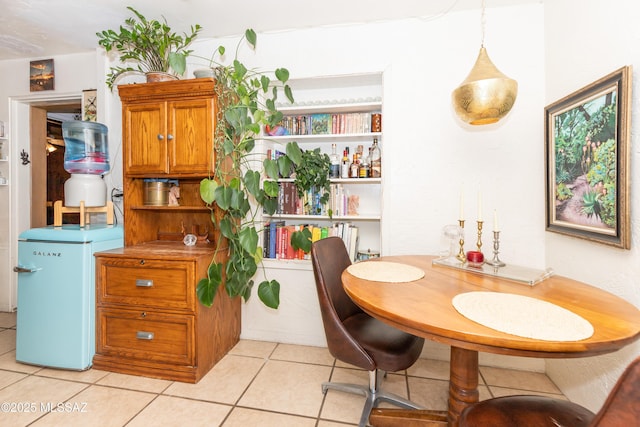 dining area featuring light tile patterned floors
