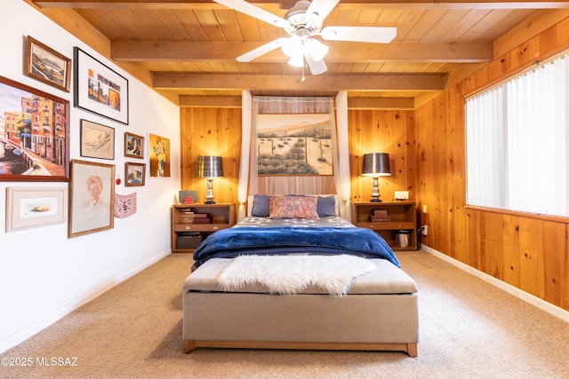 3541 E Cody St, Tucson, AZ 85716 - bedroom featuring wooden ceiling with exposed beams, carpet, wood walls, baseboards, and a ceiling fan