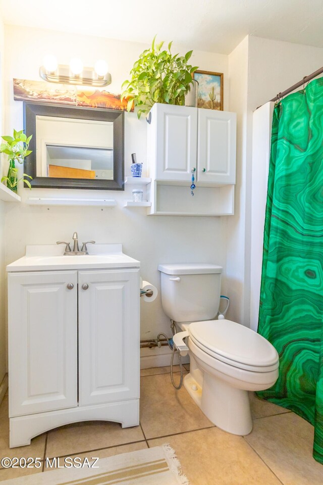 3541 E Cody St, Tucson, AZ 85716 - bathroom featuring toilet, vanity, tile patterned floors, and curtained shower