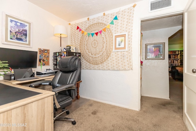 office with baseboards, visible vents, and carpet floors