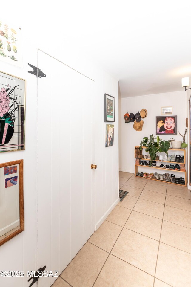 3541 E Cody St, Tucson, AZ 85716 - doorway featuring baseboards, tile patterned flooring, and plenty of natural light