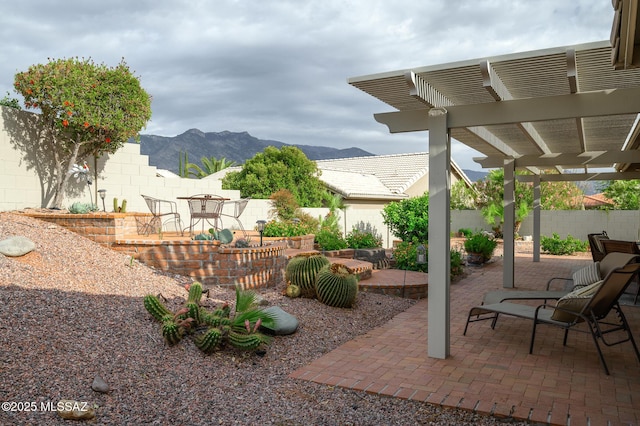 38459 S Bellrock Ct, Tucson, AZ 85739 - view of patio featuring a mountain view, a fenced backyard, and a pergola