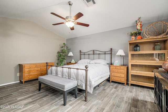 38459 S Bellrock Ct, Tucson, AZ 85739 - bedroom with vaulted ceiling, wood finished floors, baseboards, and a ceiling fan