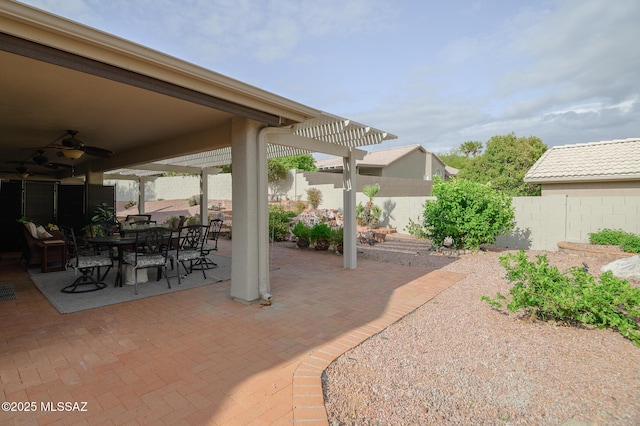 38459 S Bellrock Ct, Tucson, AZ 85739 - view of patio / terrace featuring ceiling fan, a fenced backyard, a pergola, and outdoor dining area