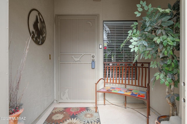 38459 S Bellrock Ct, Tucson, AZ 85739 - view of exterior entry featuring a porch and stucco siding