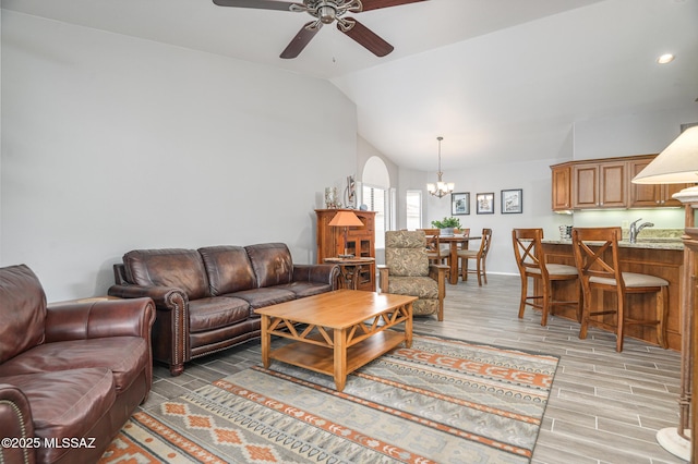 38459 S Bellrock Ct, Tucson, AZ 85739 - living room featuring ceiling fan, vaulted ceiling, a chandelier, light wood-type flooring, and recessed lighting