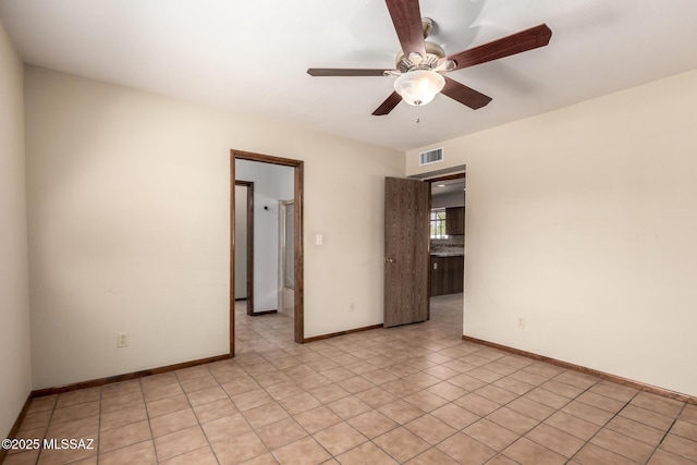 895 W Roller Coaster Rd, Tucson, AZ 85704 - spare room featuring ceiling fan and light tile patterned flooring