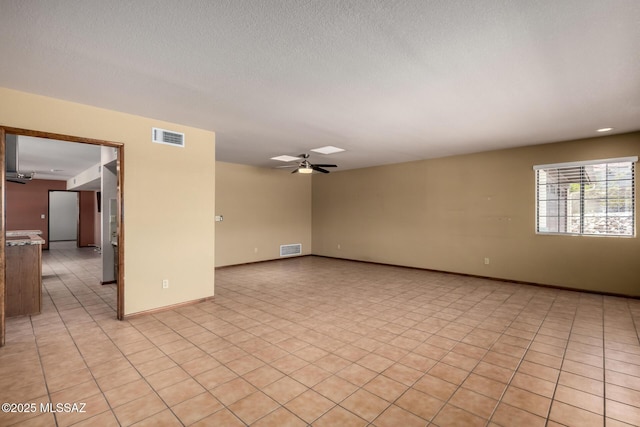 895 W Roller Coaster Rd, Tucson, AZ 85704 - spare room with ceiling fan and a textured ceiling