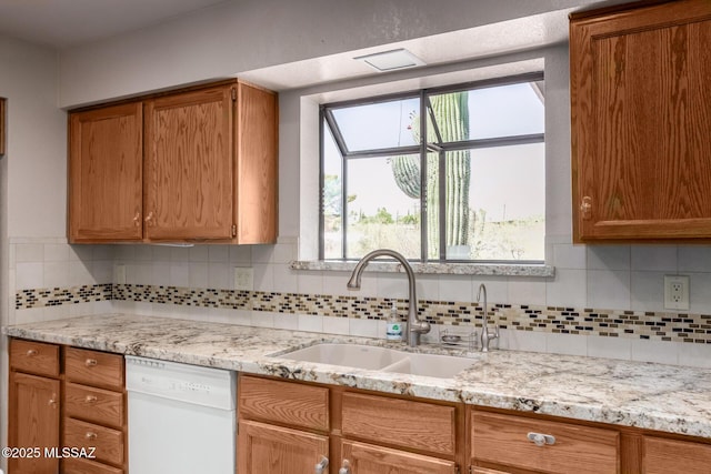 895 W Roller Coaster Rd, Tucson, AZ 85704 - kitchen with white dishwasher, decorative backsplash, and plenty of natural light
