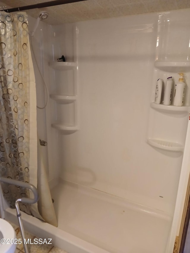 full bath with a shower with shower curtain