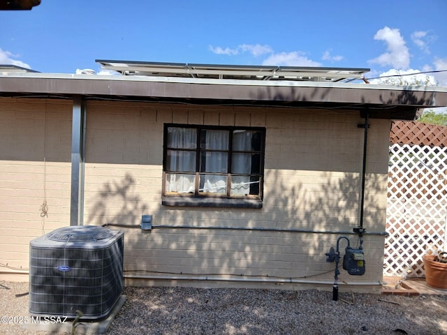 view of home's exterior with central AC unit