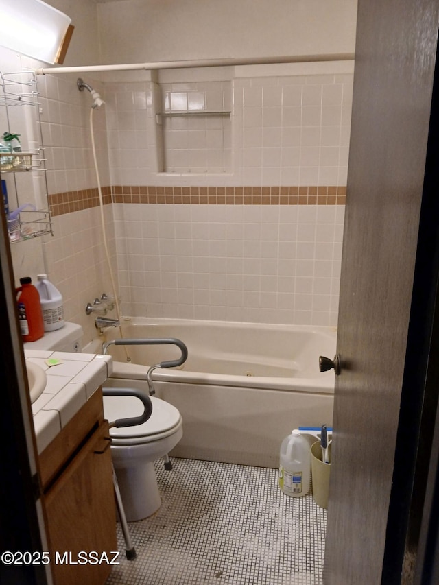 full bathroom featuring toilet, tile patterned flooring, vanity, and shower / tub combination