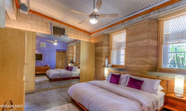 bedroom featuring a closet, visible vents, and concrete floors