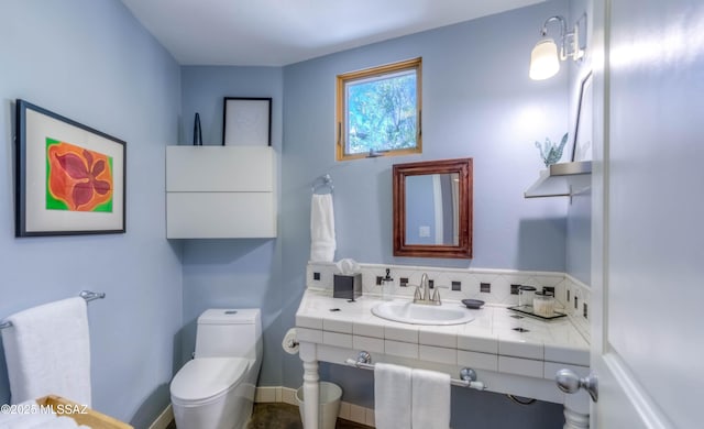bathroom with vanity and toilet