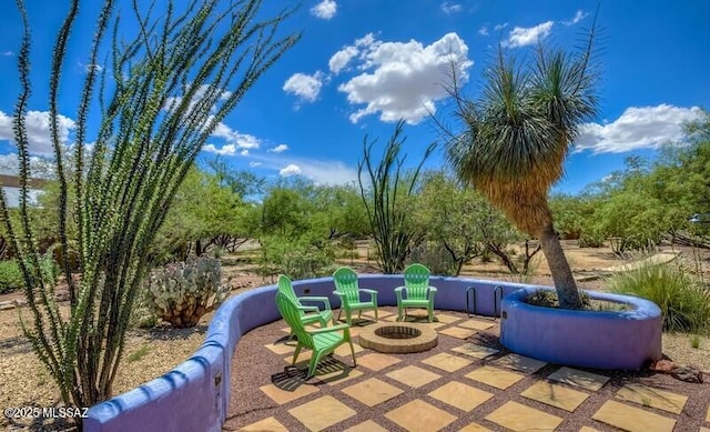 view of patio / terrace featuring an outdoor fire pit