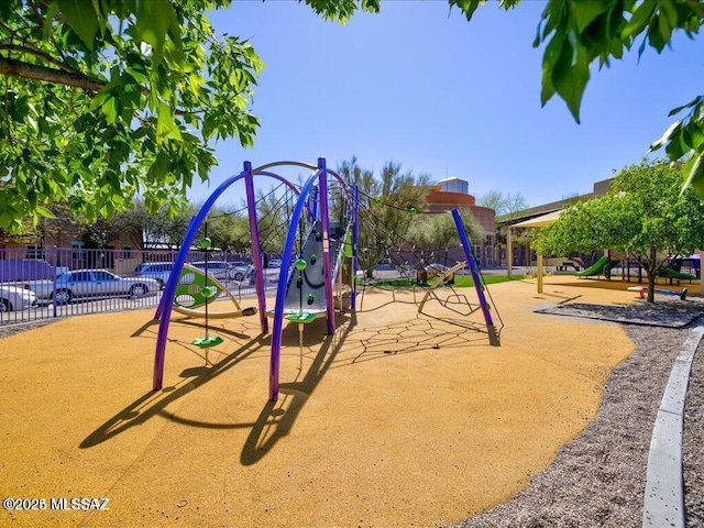 communal playground featuring fence