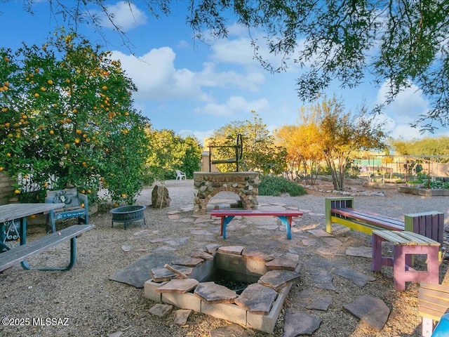 view of patio with a fire pit