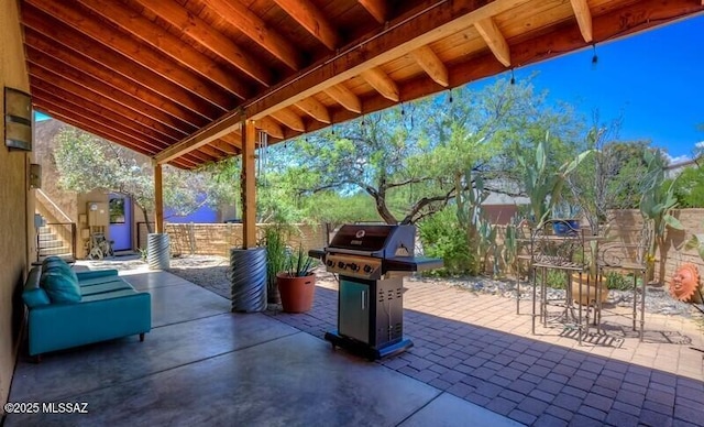 view of patio / terrace with a fenced backyard, stairs, and area for grilling