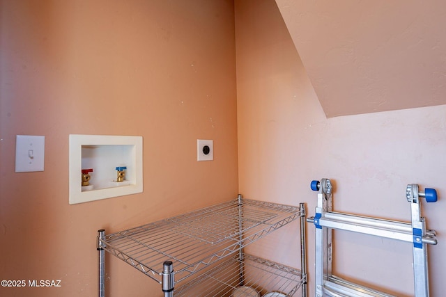 clothes washing area featuring laundry area, hookup for an electric dryer, and hookup for a washing machine