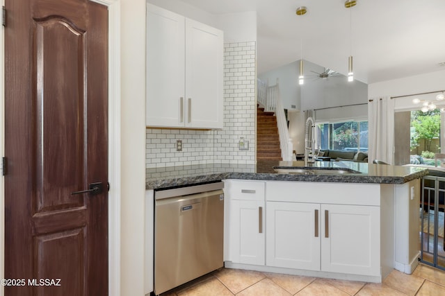 29 W Camino Rancho Viejo, Sahuarita, AZ 85629 - kitchen featuring dishwasher, a sink, a peninsula, light tile patterned flooring, and tasteful backsplash