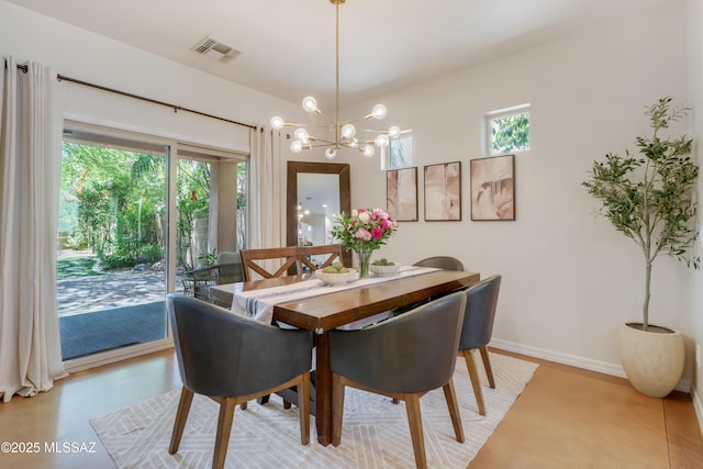 29 W Camino Rancho Viejo, Sahuarita, AZ 85629 - dining space with plenty of natural light, a chandelier, and baseboards