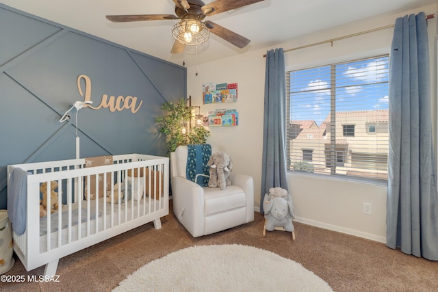 29 W Camino Rancho Viejo, Sahuarita, AZ 85629 - bedroom featuring carpet flooring, a crib, baseboards, and a ceiling fan