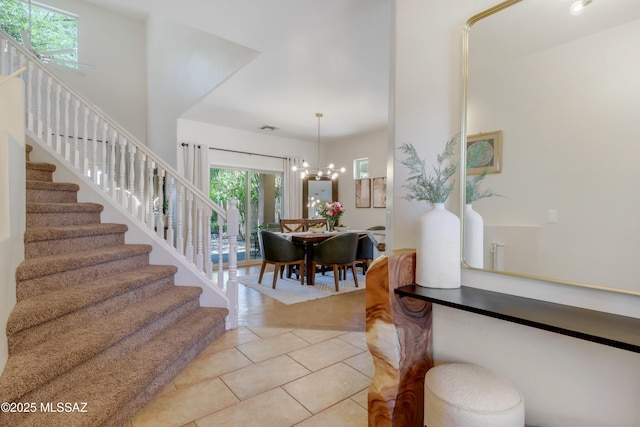 29 W Camino Rancho Viejo, Sahuarita, AZ 85629 - foyer entrance with stairs, light tile patterned floors, and a chandelier