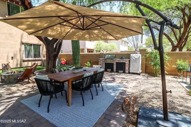 29 W Camino Rancho Viejo, Sahuarita, AZ 85629 - view of patio featuring an outdoor fire pit, a fenced backyard, outdoor dining area, and area for grilling