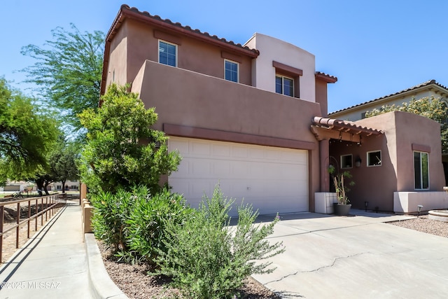 29 W Camino Rancho Viejo, Sahuarita, AZ 85629 - view of front facade with concrete driveway, stucco siding, a tiled roof, and an attached garage