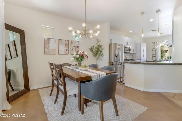 29 W Camino Rancho Viejo, Sahuarita, AZ 85629 - dining area featuring a chandelier, finished concrete floors, recessed lighting, and baseboards