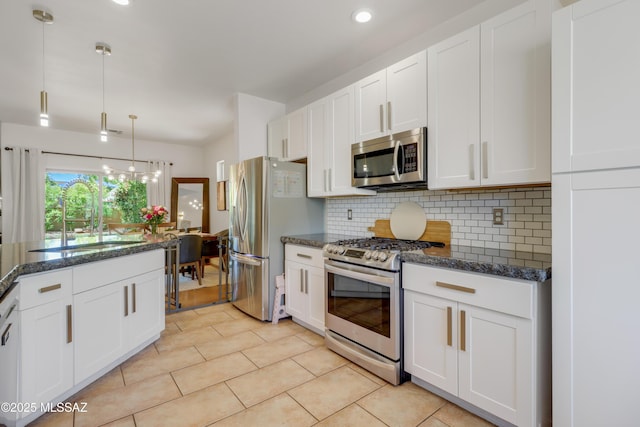 29 W Camino Rancho Viejo, Sahuarita, AZ 85629 - kitchen featuring appliances with stainless steel finishes, a sink, tasteful backsplash, white cabinetry, and recessed lighting