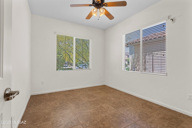 11413 E Squash Blossom Loop, Tucson, AZ 85747 - spare room with a ceiling fan and baseboards