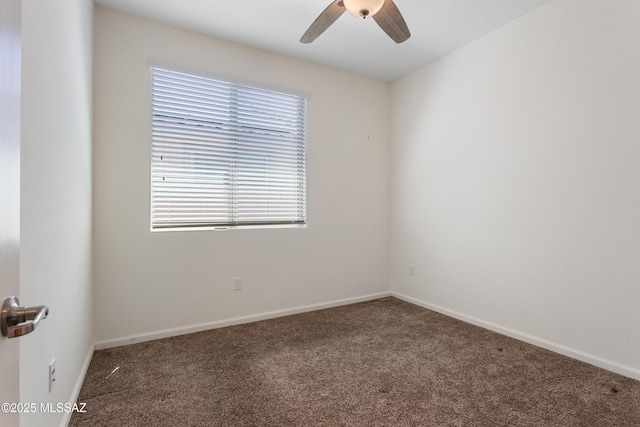 11413 E Squash Blossom Loop, Tucson, AZ 85747 - empty room with carpet, ceiling fan, and baseboards