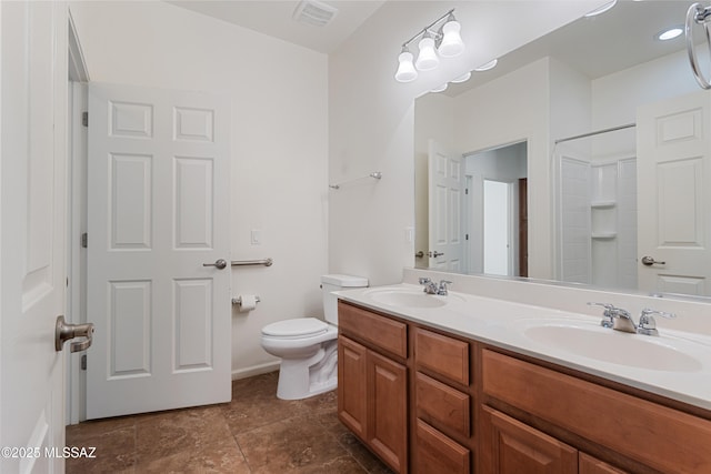 11413 E Squash Blossom Loop, Tucson, AZ 85747 - bathroom with toilet, double vanity, and a shower