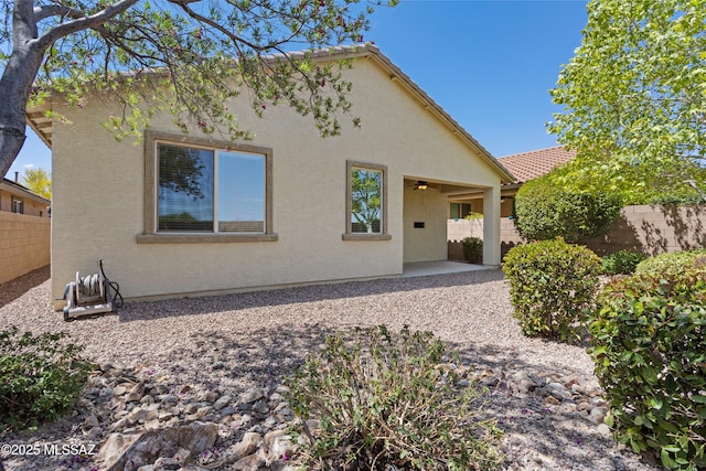 11413 E Squash Blossom Loop, Tucson, AZ 85747 - back of property with a fenced backyard, a patio, and stucco siding
