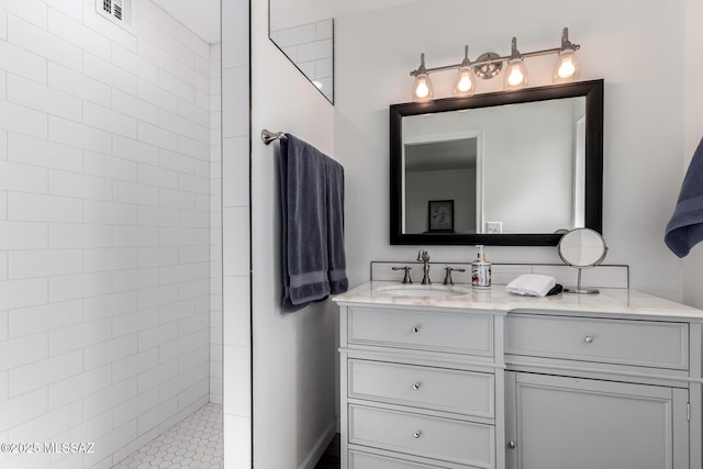full bath with walk in shower, visible vents, and vanity