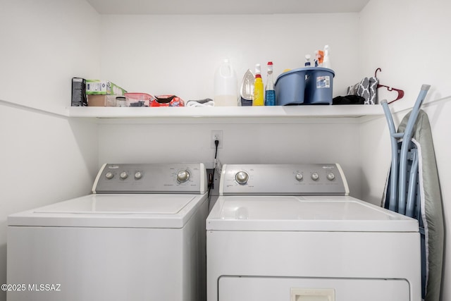 washroom with laundry area and washing machine and dryer