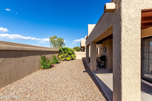 view of yard with a patio and a fenced backyard