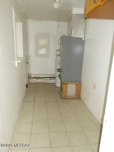 2491 N Joe Hines Rd, Willcox, AZ 85643 - hall with water heater, light tile patterned floors, and heating unit
