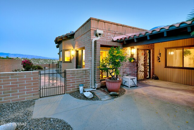 4180 N Camino Ferreo, Tucson, AZ 85750 - exterior space with a mountain view, fence, and a gate