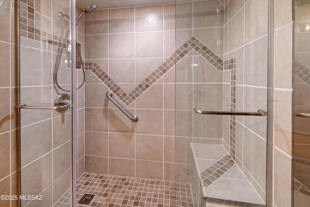 full bath with a shower stall