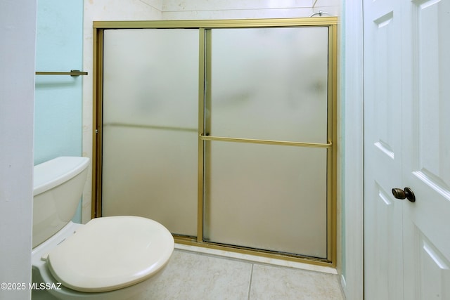 bathroom with an enclosed shower, toilet, and tile patterned flooring