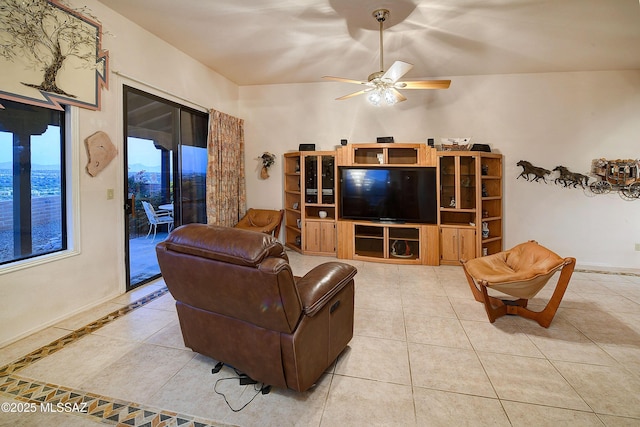 tiled living area featuring a ceiling fan