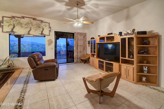 living room with light tile patterned floors and a ceiling fan
