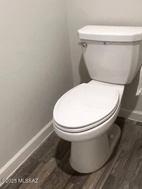 365 S Redwood Loop, Benson, AZ 85602 - bathroom with toilet, wood finished floors, and baseboards