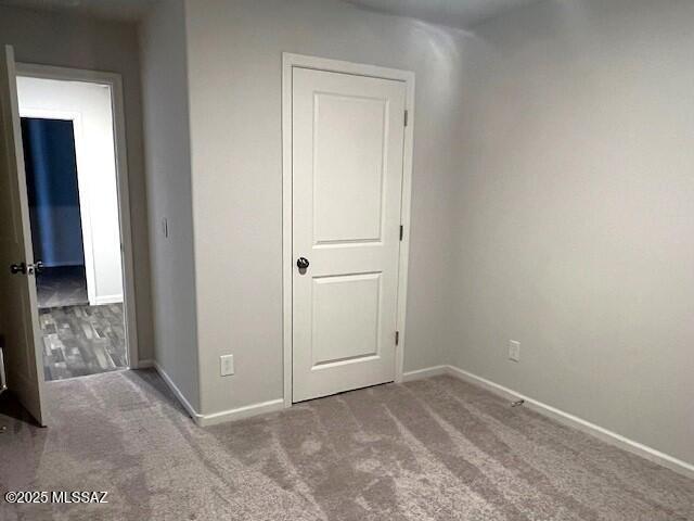 365 S Redwood Loop, Benson, AZ 85602 - unfurnished bedroom featuring carpet floors and baseboards